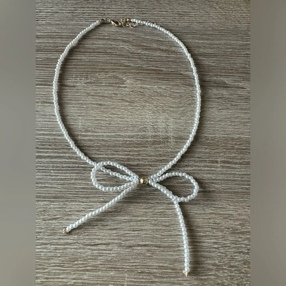 Free People White Pearl Bow Necklace with Gold Accents - Picture 2 of 3